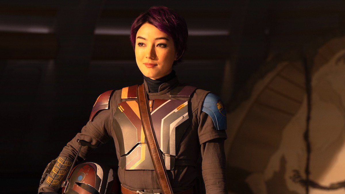 Sabine holds her helmet