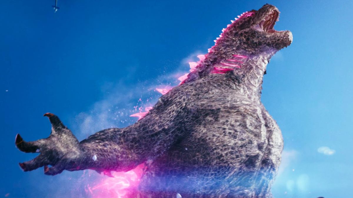 Pink Godzilla taucht brüllend aus dem Eis auf.  Dieses Bild ist Teil eines Artikels darüber, warum Godzilla im New Empire-Trailer rosa ist.