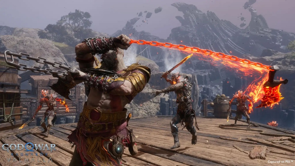 Image of bald man in warrior gear swinging a fiery chain weapon to attack a zombie creature in God of War Ragnarok Valhalla DLC.