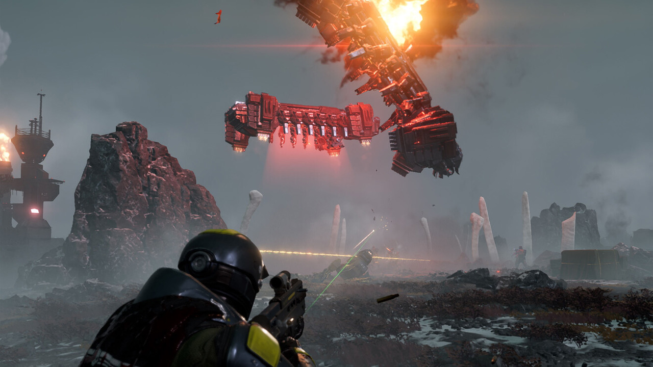 A man in a sci-fi set of armour shooting away as two space-ships crash in front of him.